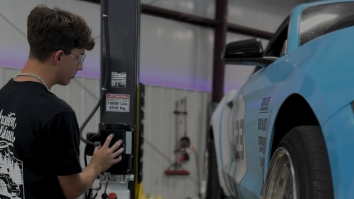 Car being lifted on an automotive lift at LATE Garage